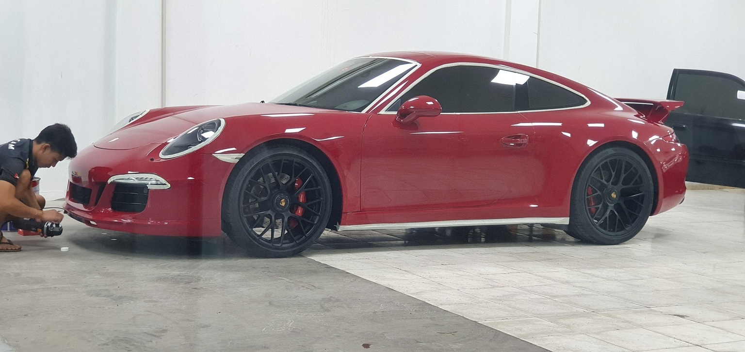 Car Detailing on Red Porshe Car by Team Foilers