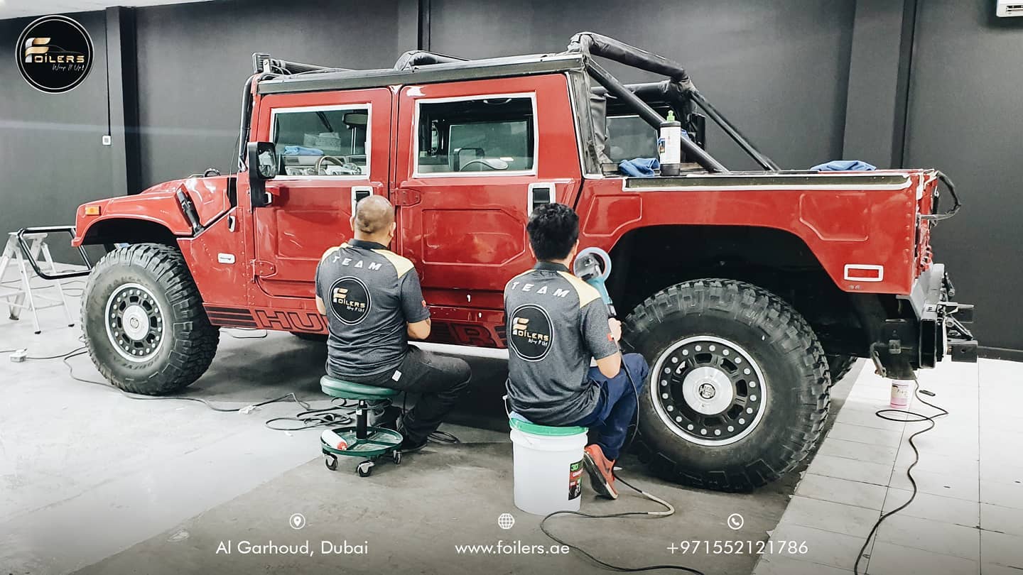 Car Wrapping on Red Hummer By Team Foilers
